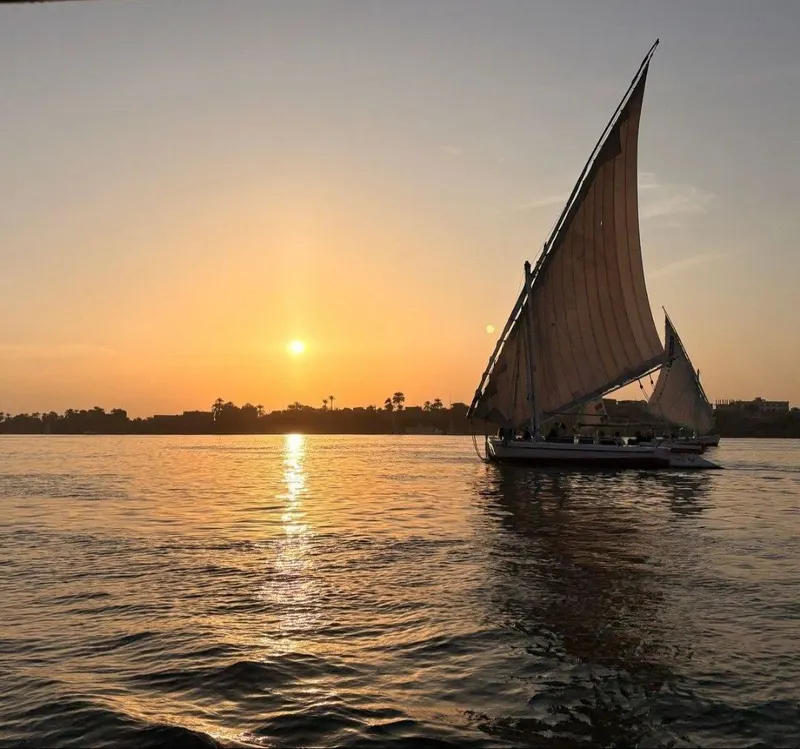 A felucca sailing on the Nile at sunset