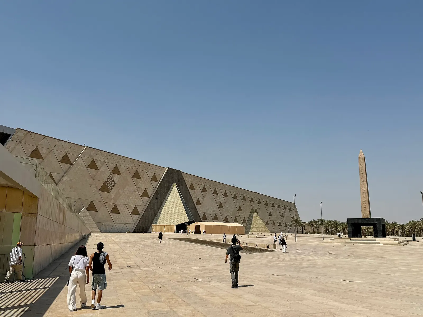 The Grand Egyptian Museum's triangle facade, with an obelisk at the entrance