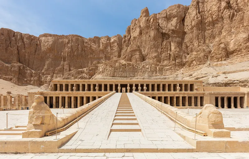 Temple of Hatshepsut in front of golden cliffs